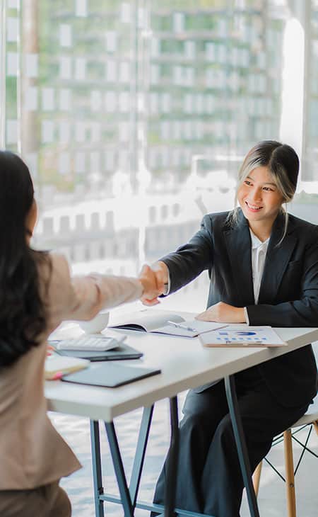 100+ Essential Business Analyst Interview Questions Evinex Corporation | Staffing Agency women-job-interview-handshake