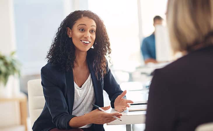 100+ Essential Business Analyst Interview Questions Evinex Corporation | Staffing Agency women-smiling-talking
