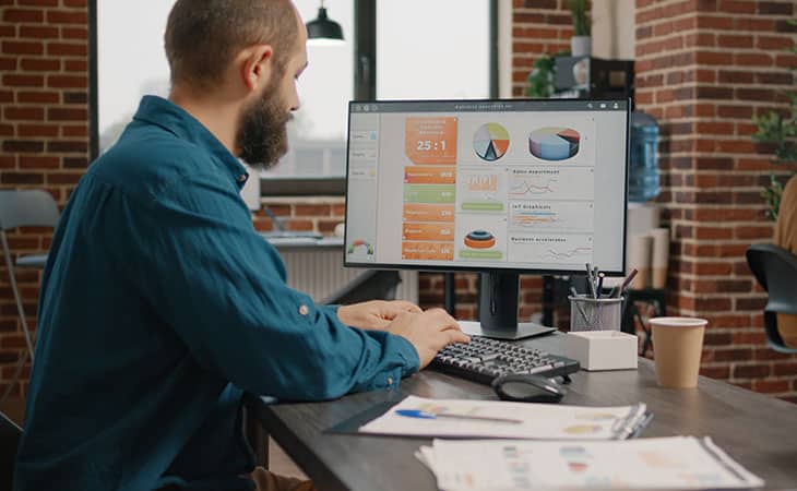 100+ Essential Business Analyst Interview Questions Evinex Corporation | Staffing Agency man-working-computer-data