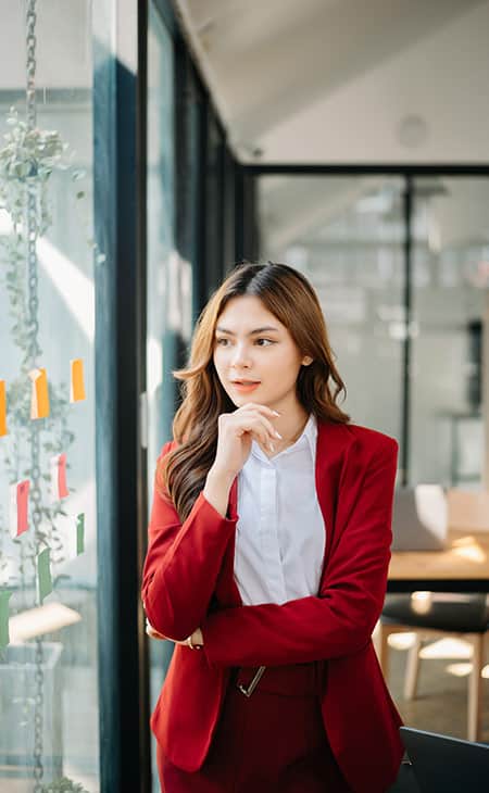 How To Hire An Employee: A Step-By-Step Complete Guide Evinex Corporation | Staffing Agency woman looking at the window post its
