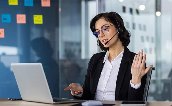 How To Hire An Employee: A Step-By-Step Complete Guide Evinex Corporation | Staffing Agency woman making a video conference and making gestures
