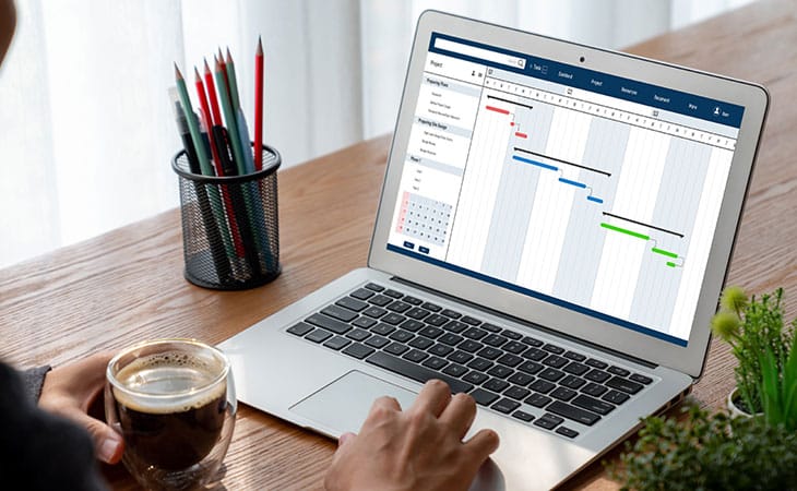 Sales Manager Job Description: Attract And Hire Top Talent Evinex Corporation | Staffing Agency detail of two hands using a laptop