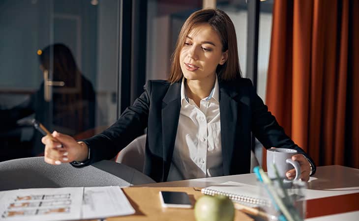 100+ Interview Questions For The Perfect Executive Assistant Evinex Corporation | Staffing Agency diligent-woman-working-office-pen-papers