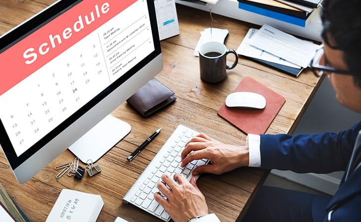100+ Interview Questions For The Perfect Executive Assistant Evinex Corporation | Staffing Agency man-using-computer-schedule