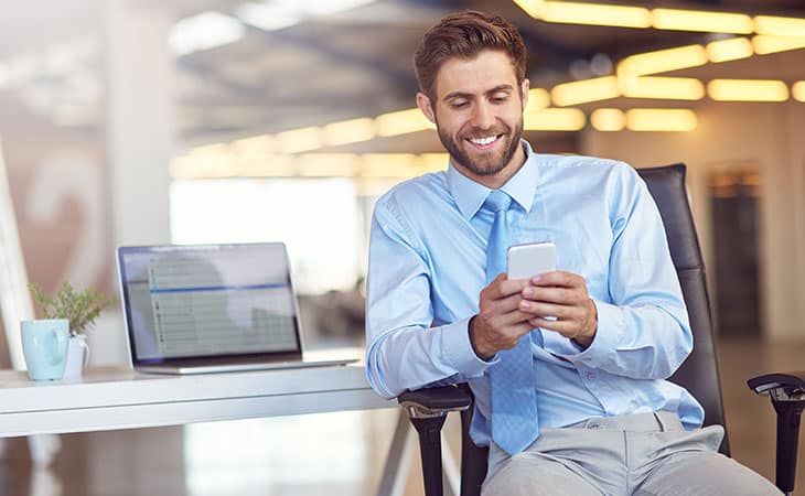 100+ Interview Questions For The Perfect Executive Assistant Evinex Corporation | Staffing Agency smiling-man-using-phone-email-laptop