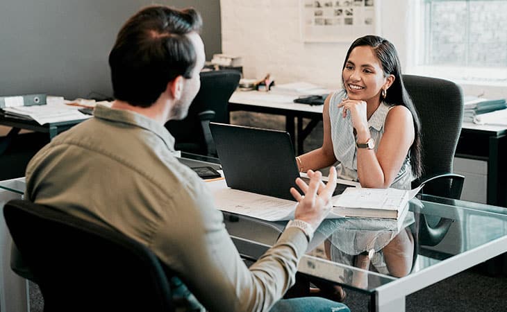 a woman and a man having an interview