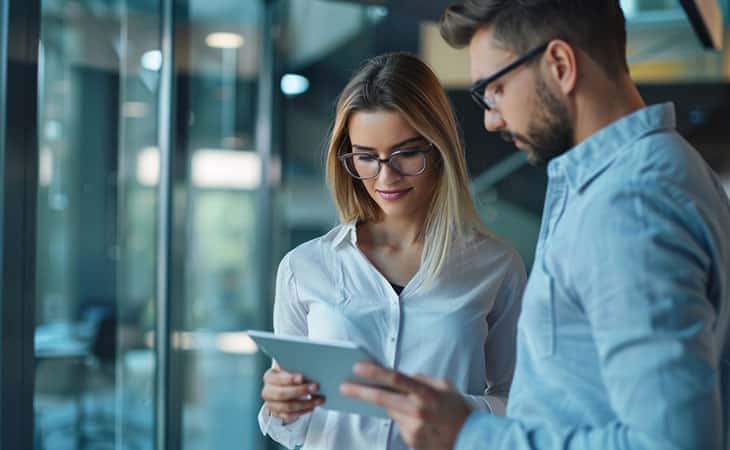 woman and men looking at tablet