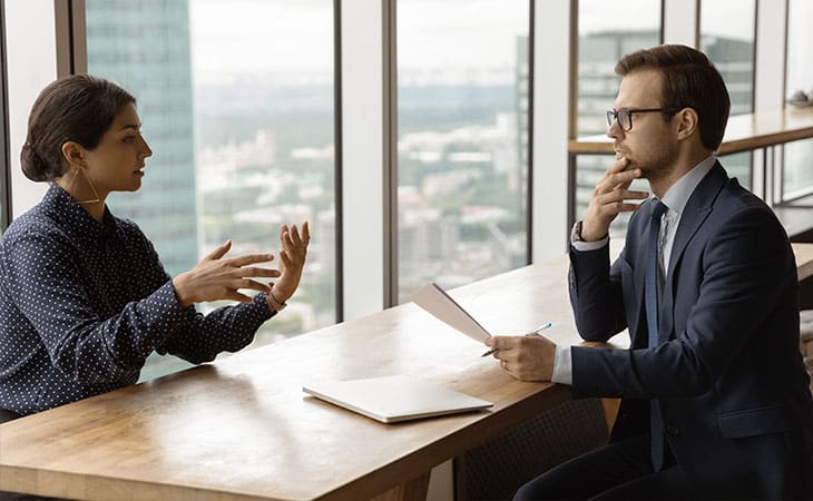 Best Fonts For Your Resume: Stand Out Professionaly Evinex Corporation | Staffing Agency a man interviewing a woman