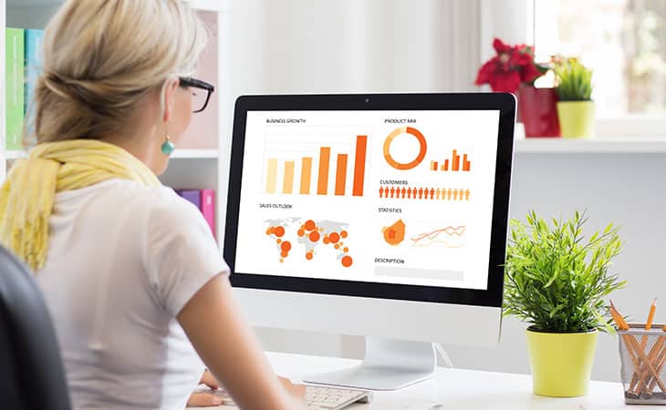 100+ Sales Manager Interview Questions With Answers Evinex Corporation | Staffing Agency a woman looking at a computer screen with graphs