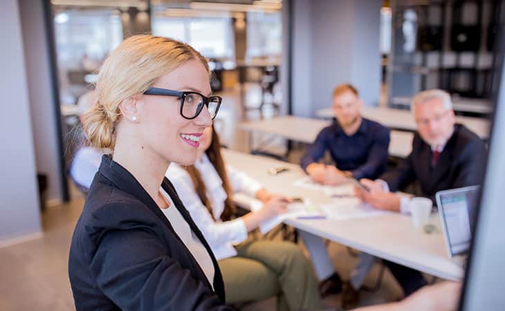 What Is A Chief Of Staff? Key Responsibilities And More Evinex Corporation | Staffing Agency a woman making a presentation in the office