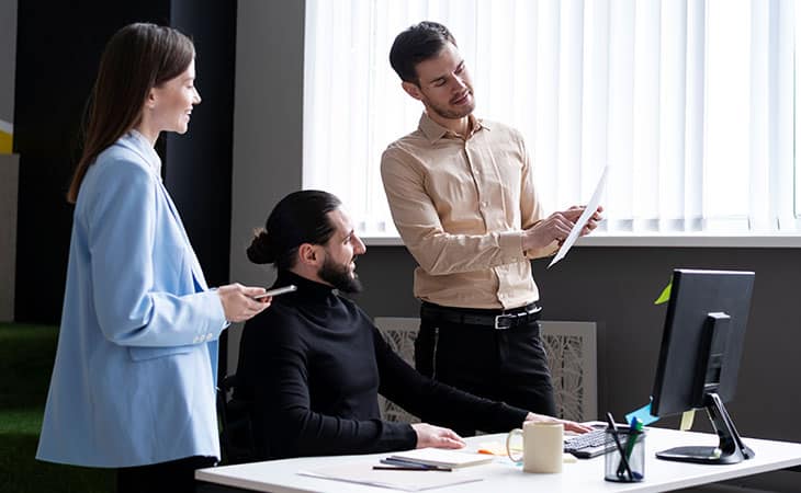 What Is A Chief Of Staff? Key Responsibilities And More Evinex Corporation | Staffing Agency three office workers talking