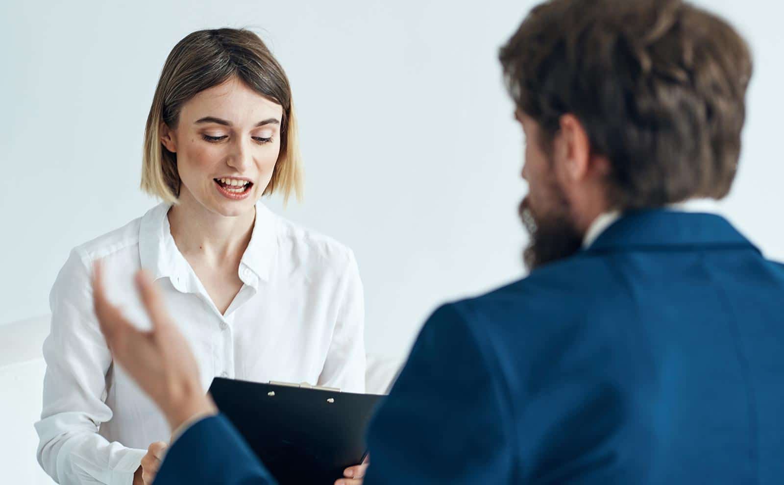 a woman interviewing a man