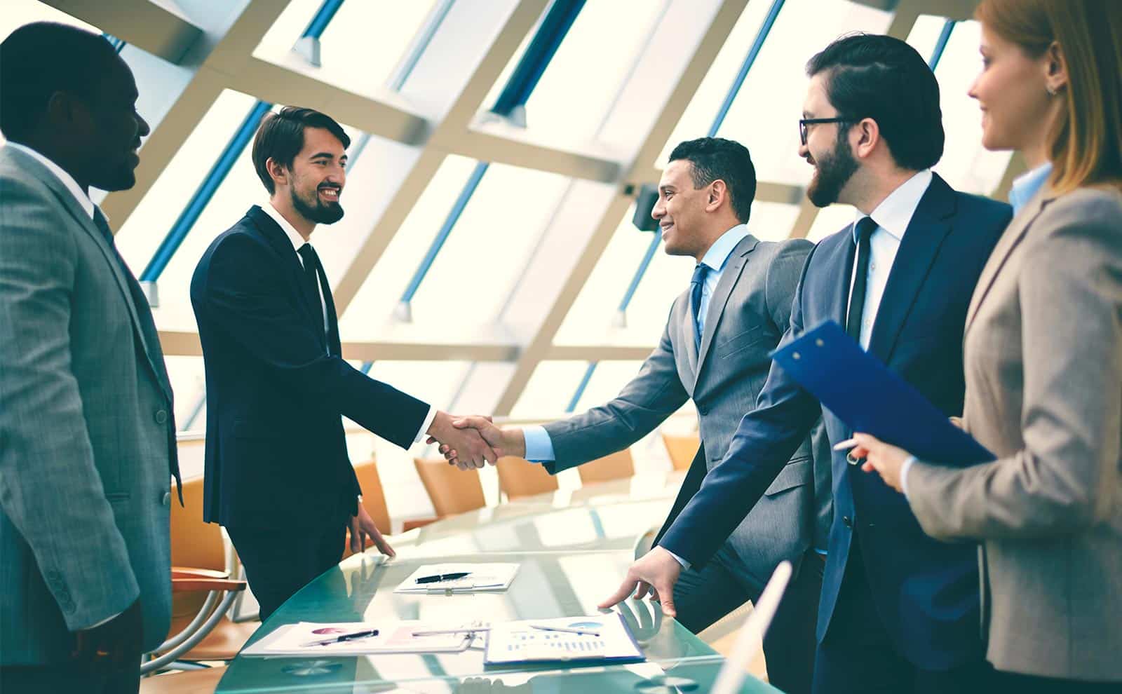 happy business people handshaking