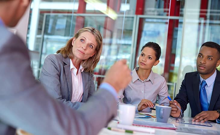 How To Conduct A Job Interview For Better Hiring Decisions Evinex Corporation | Staffing Agency a business meeting in an office with a modern glass space
