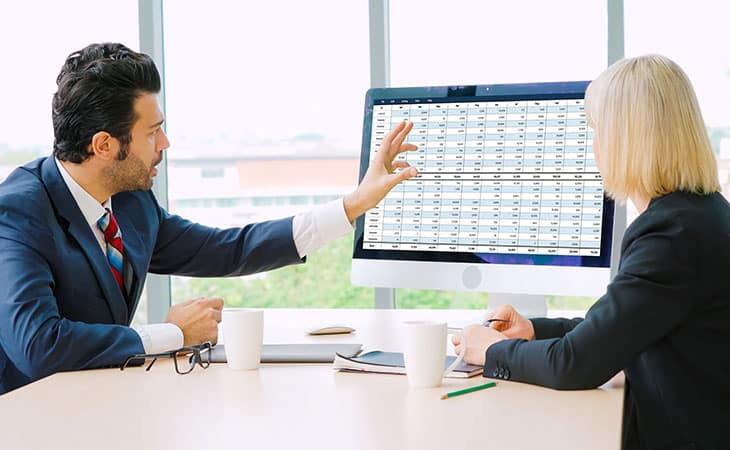 100+ Chief Of Staff Interview Questions. Find Top Leaders Evinex Corporation | Staffing Agency a man pointing at a screen and a woman in the office
