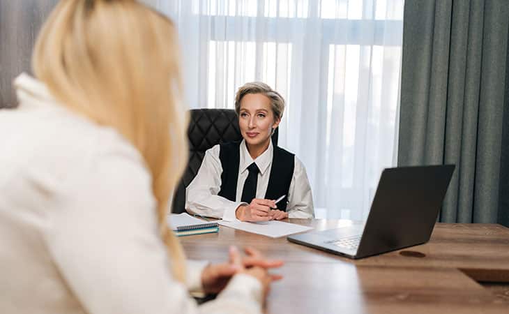 100+ Chief Of Staff Interview Questions. Find Top Leaders Evinex Corporation | Staffing Agency businesswomen talking in an office