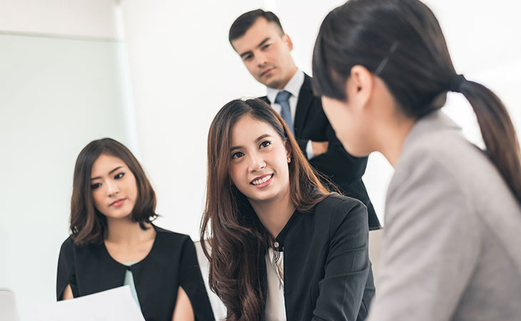 How To Lead A Team: Strategies For Effective Leadership Evinex Corporation | Staffing Agency a group of business people talking
