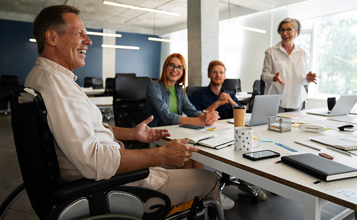 a group of office workers smiling