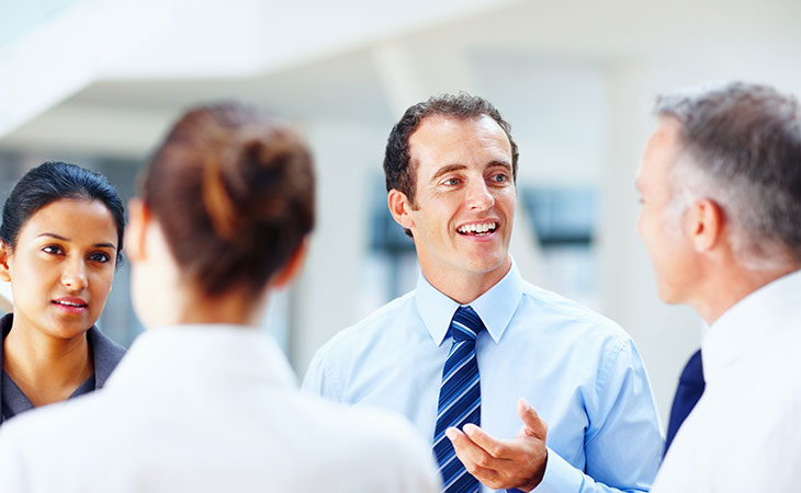 What Is Teamwork And Why Is It Important For Success? Evinex Corporation | Staffing Agency a man talking to a group