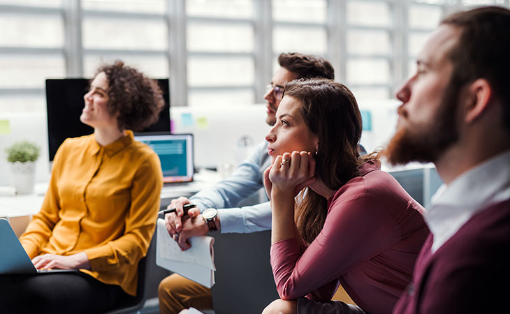 people are listening to an office presentation