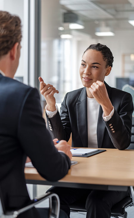 How To Impress In An Interview: Tips To Stand Out Evinex Corporation | Staffing Agency two business people talking