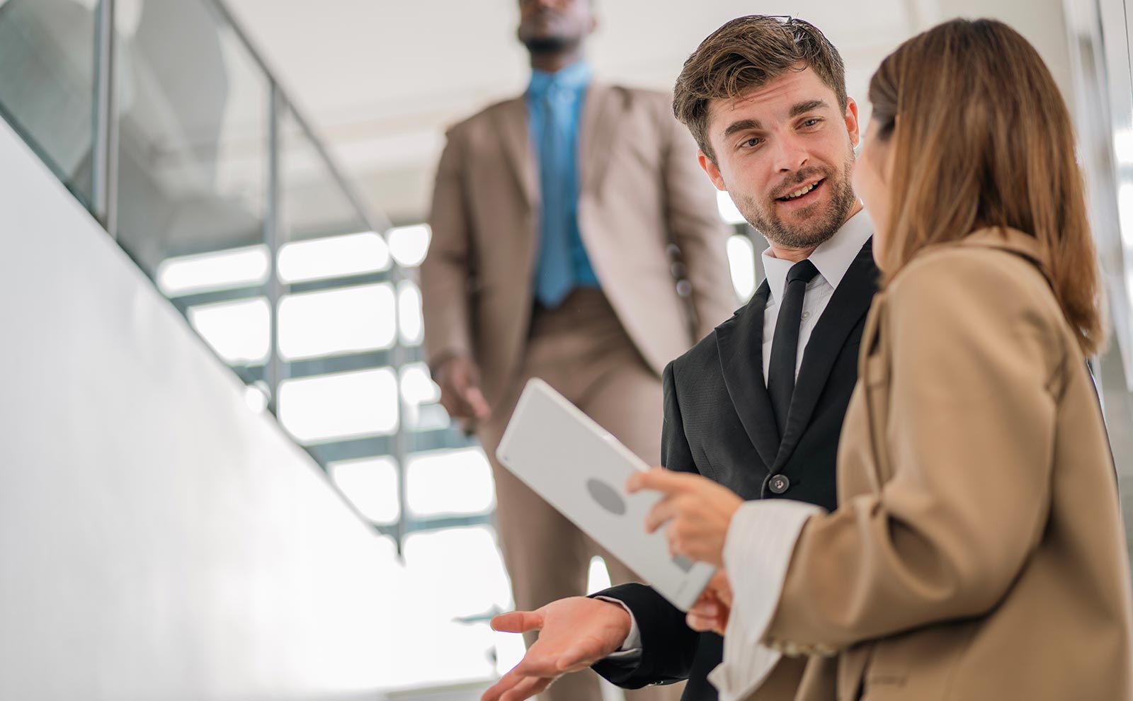 two business workers talking in the stairs
