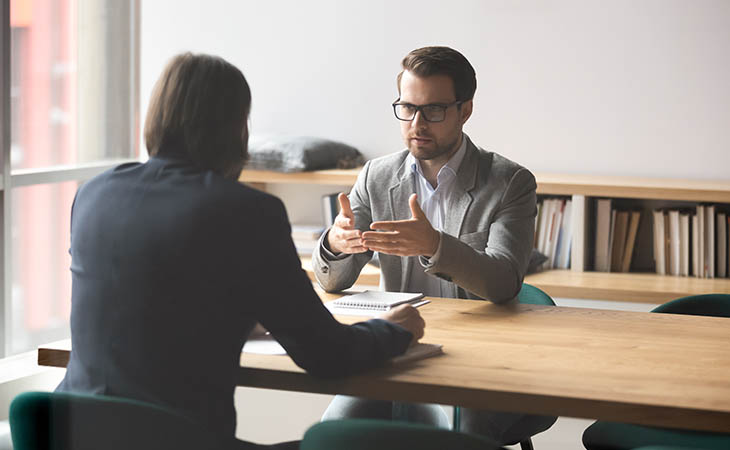 Interview Cheat Sheet: Essential Tips To Ace Your Interview Evinex Corporation | Staffing Agency two men doing a job interview